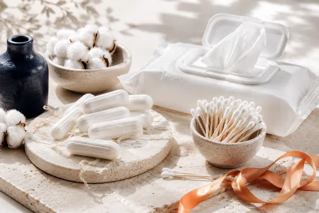 Personal-care essentials arranged on bright stone